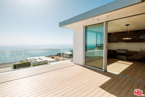 a bedroom with a bed and walk in closet