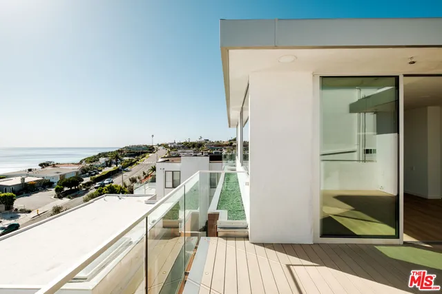 a view of a balcony with an outdoor space