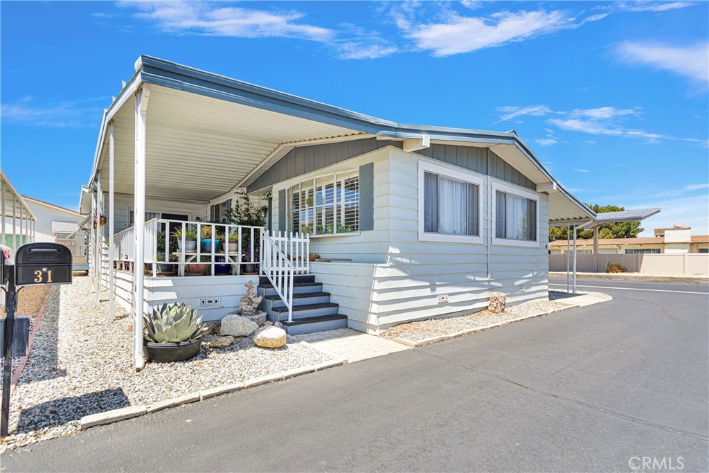 a front view of a house with a basket ball court