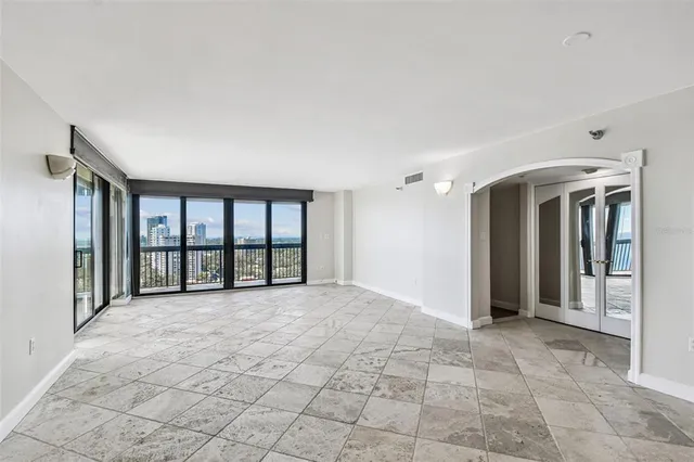 a view of an empty room with a window