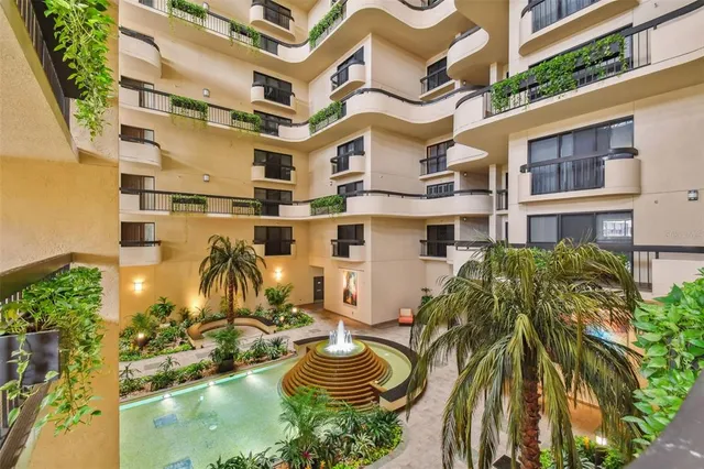 a view of a swimming pool with a house