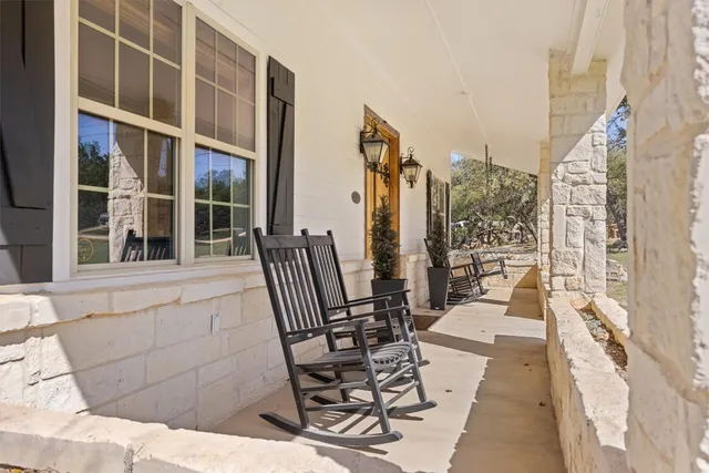 a view of balcony with furniture