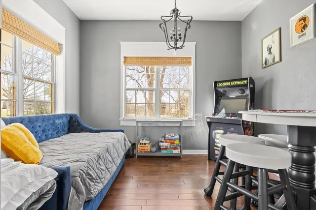 a bedroom with a bed and a table