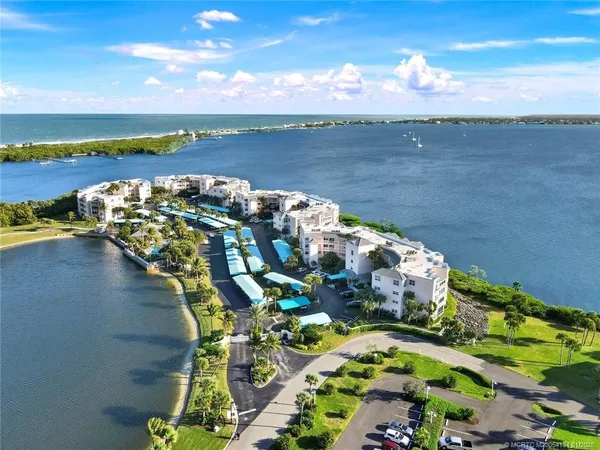an aerial view of a house with a ocean view