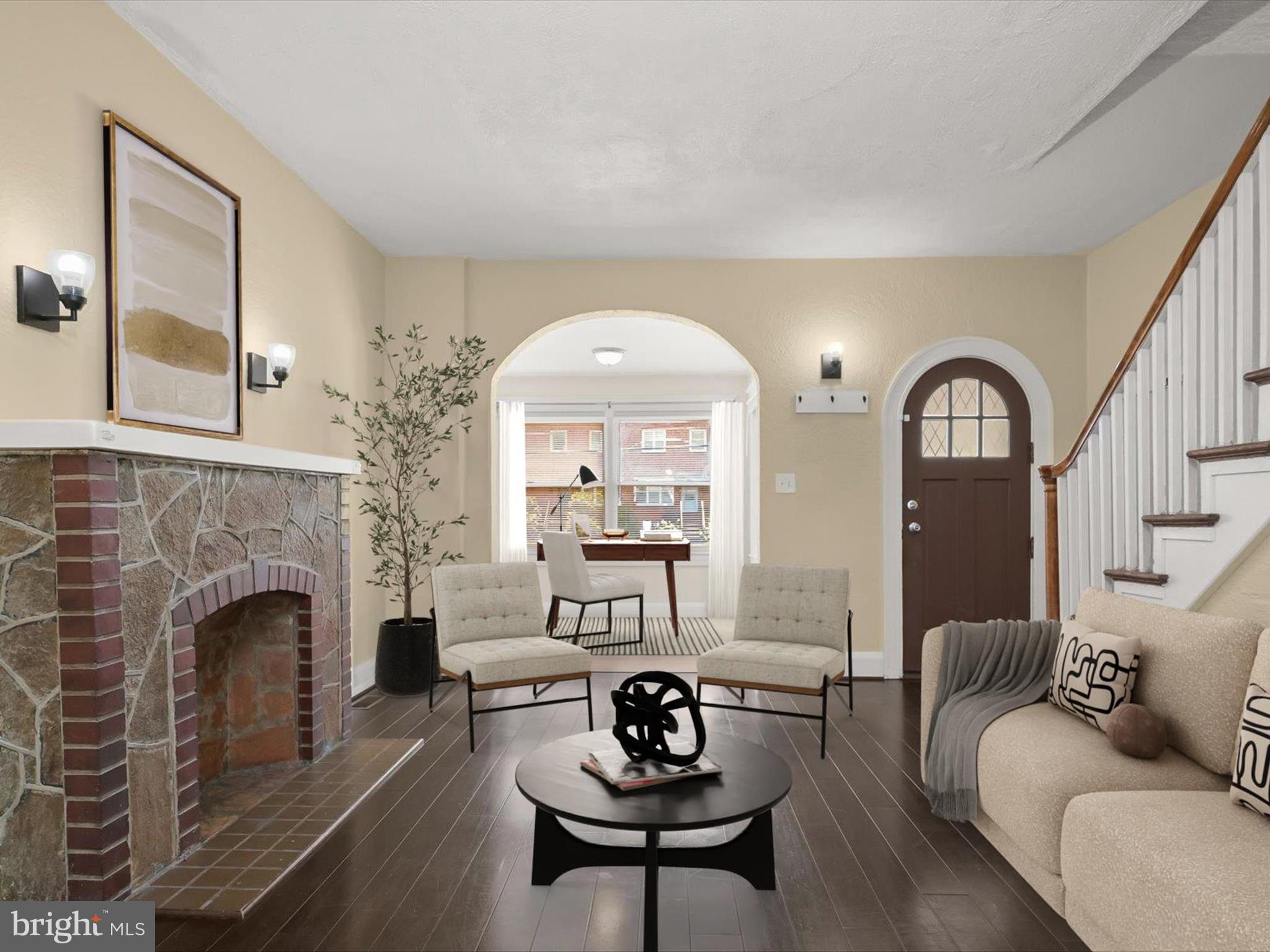 6204 Frederick Road Baltimore, MD 21228 - Photo 2 of 56 a living room with furniture and a fireplace