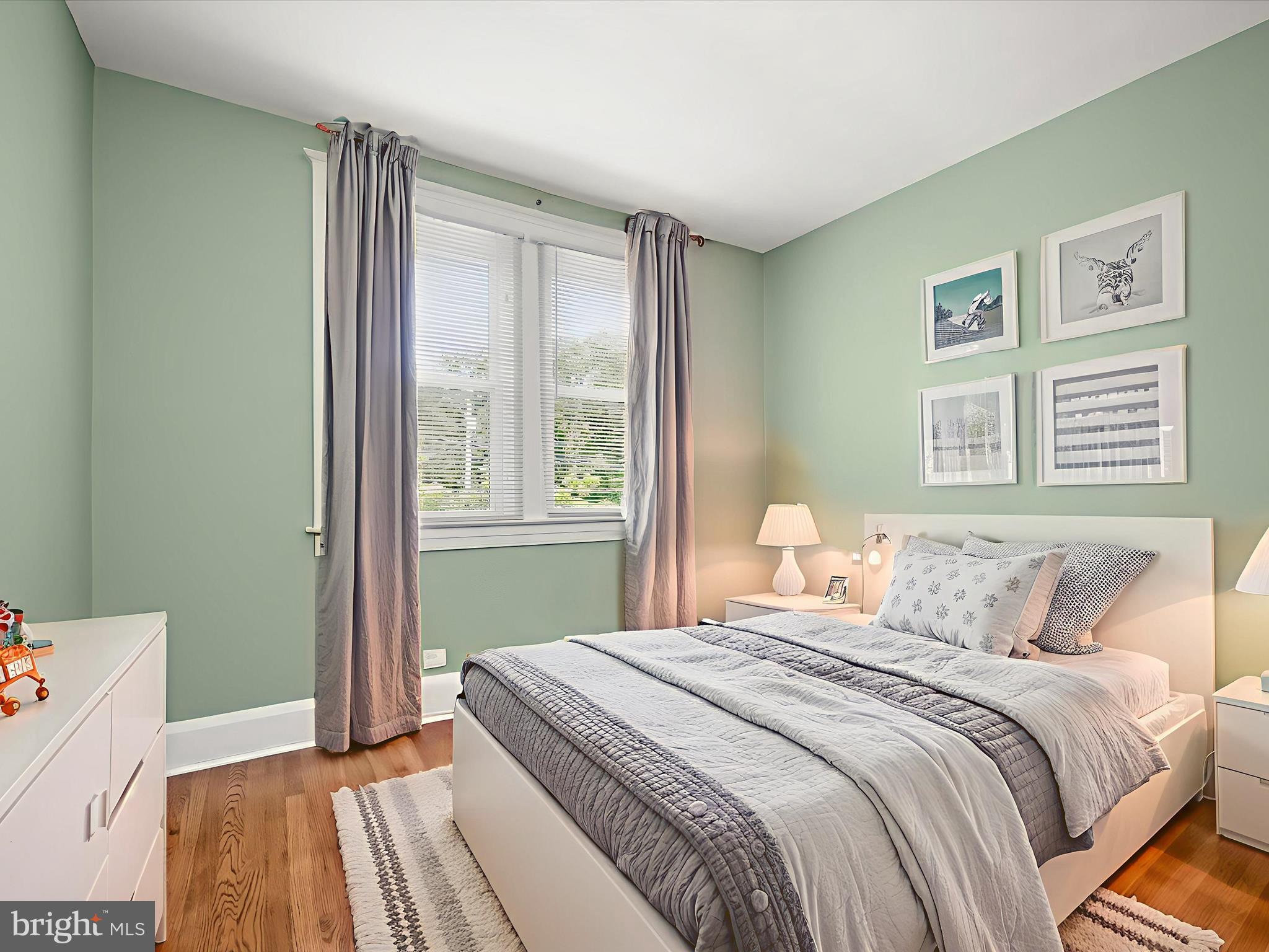 6204 Frederick Road Baltimore, MD 21228 - Photo 34 of 56 a bedroom with a bed and a window