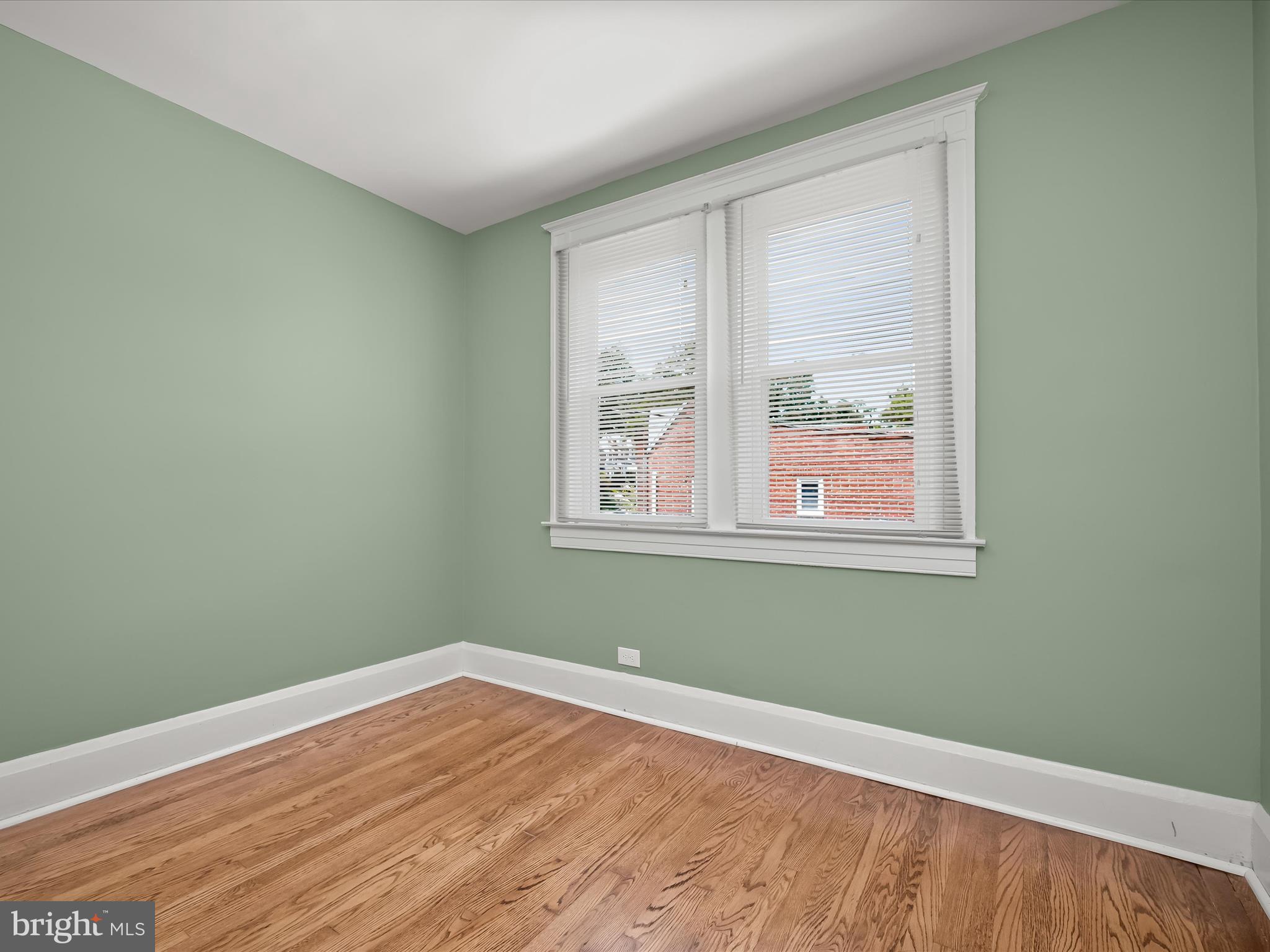 6204 Frederick Road Baltimore, MD 21228 - Photo 35 of 56 a view of a room with wooden floor and windows