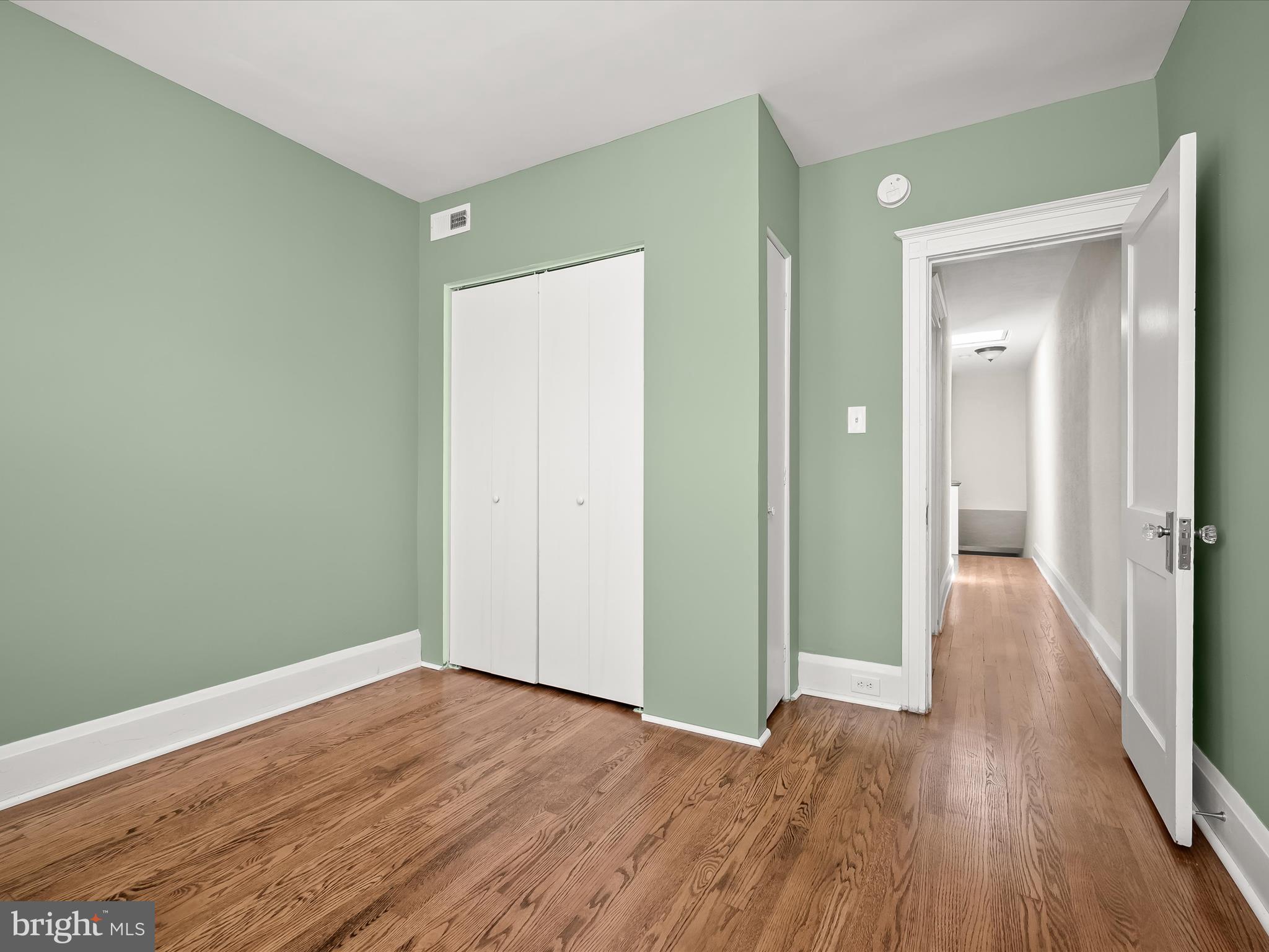6204 Frederick Road Baltimore, MD 21228 - Photo 36 of 56 a view of a hallway with wooden floor