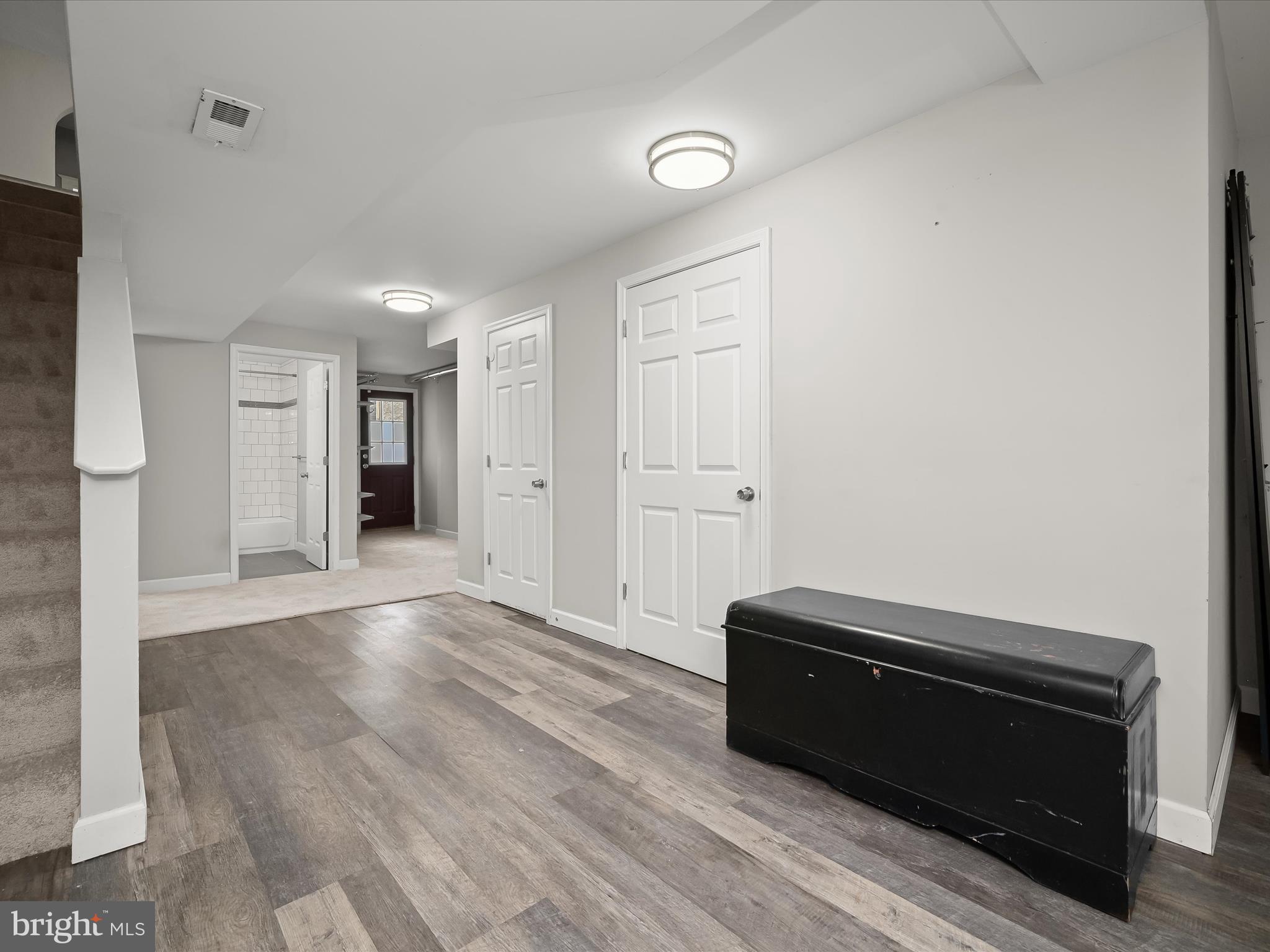 6204 Frederick Road Baltimore, MD 21228 - Photo 37 of 56 a view of room with wooden floor