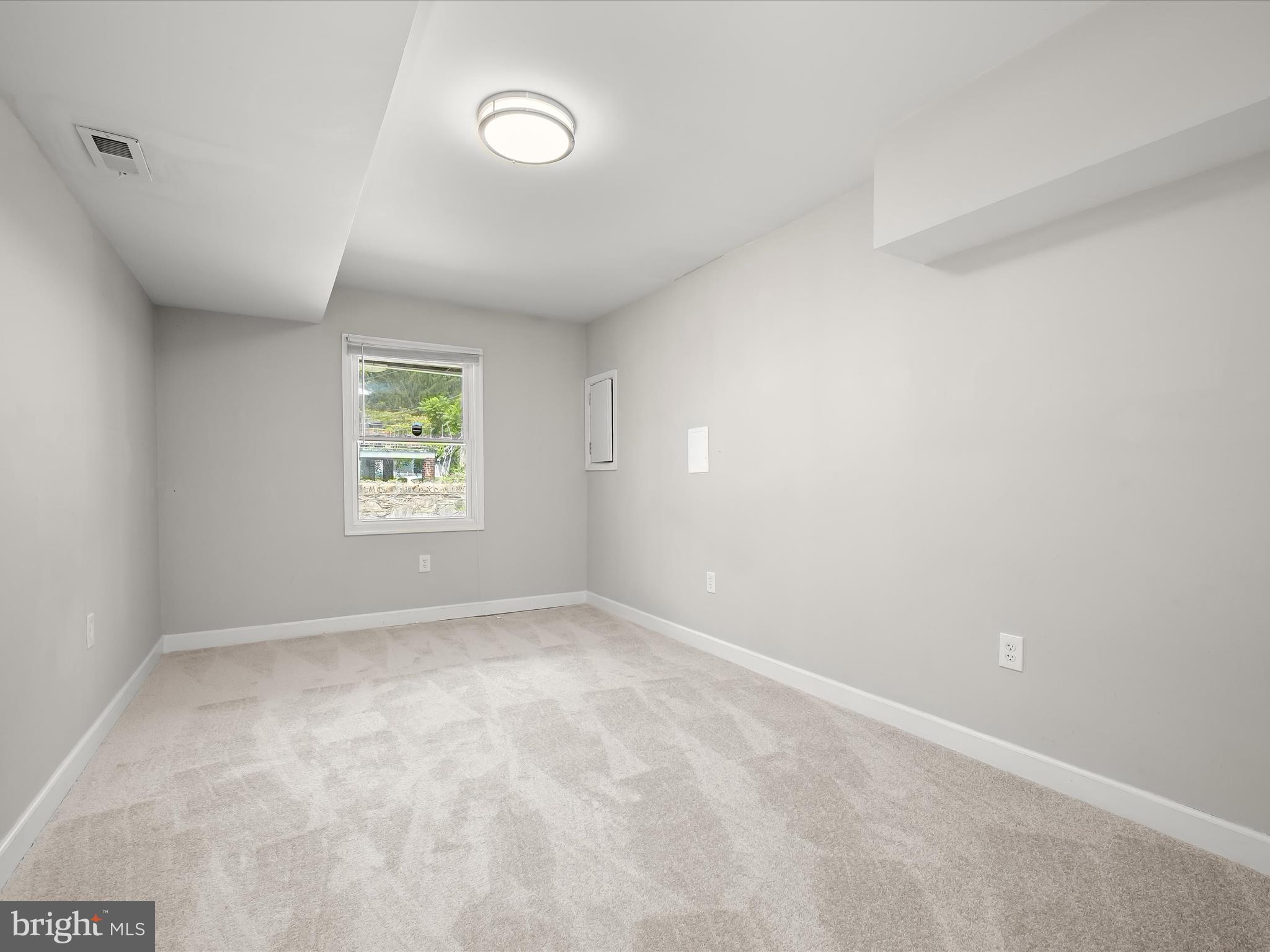 6204 Frederick Road Baltimore, MD 21228 - Photo 43 of 56 an empty room with a window
