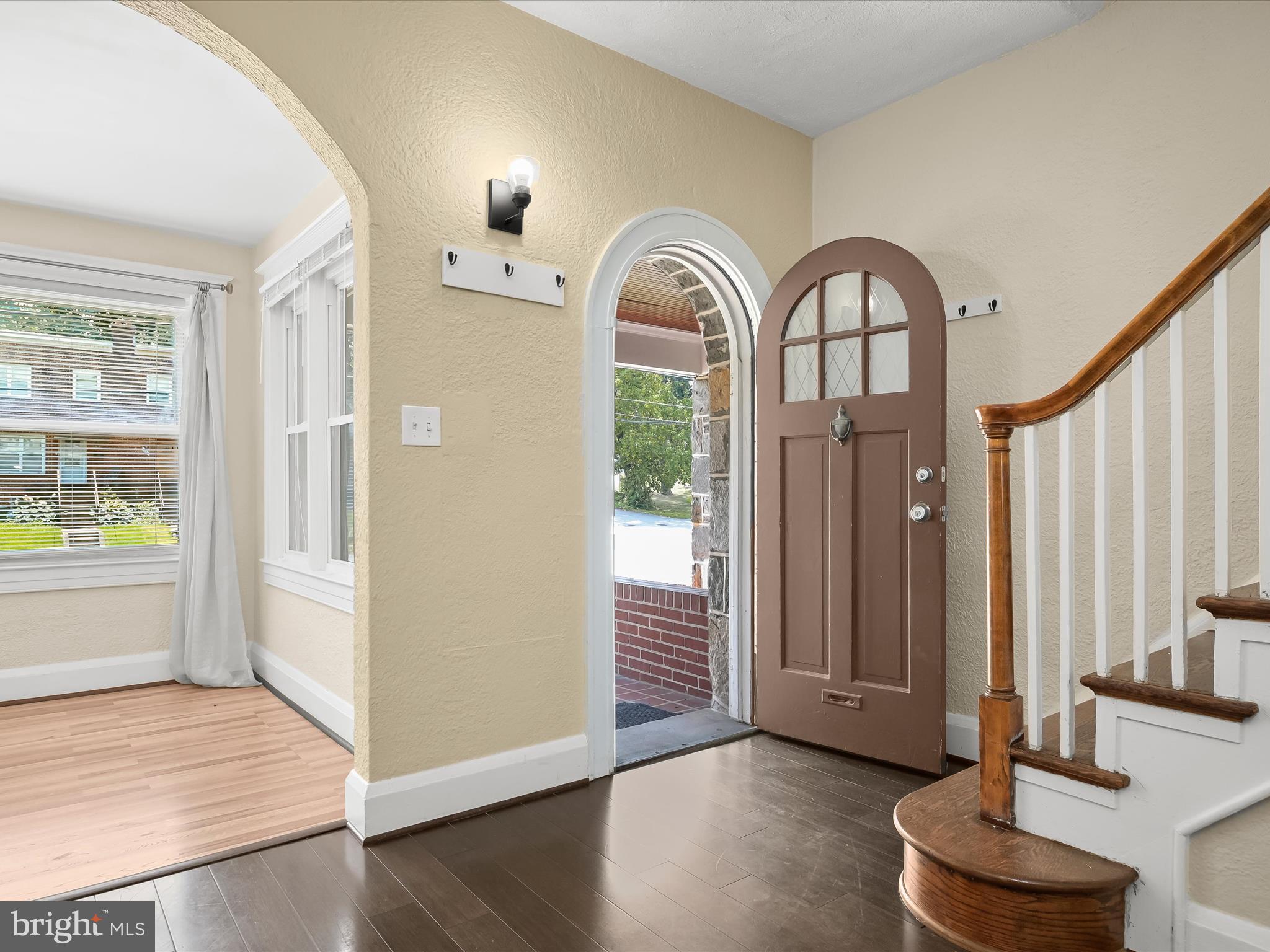 6204 Frederick Road Baltimore, MD 21228 - Photo 8 of 56 a view of an entryway with wooden floor and a window
