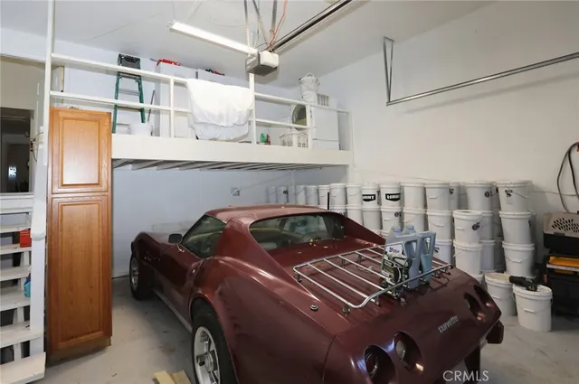 a bedroom with a bed and a tv