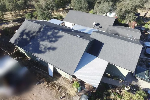 an aerial view of house with yard