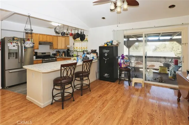 a kitchen with a sink appliances and cabinets