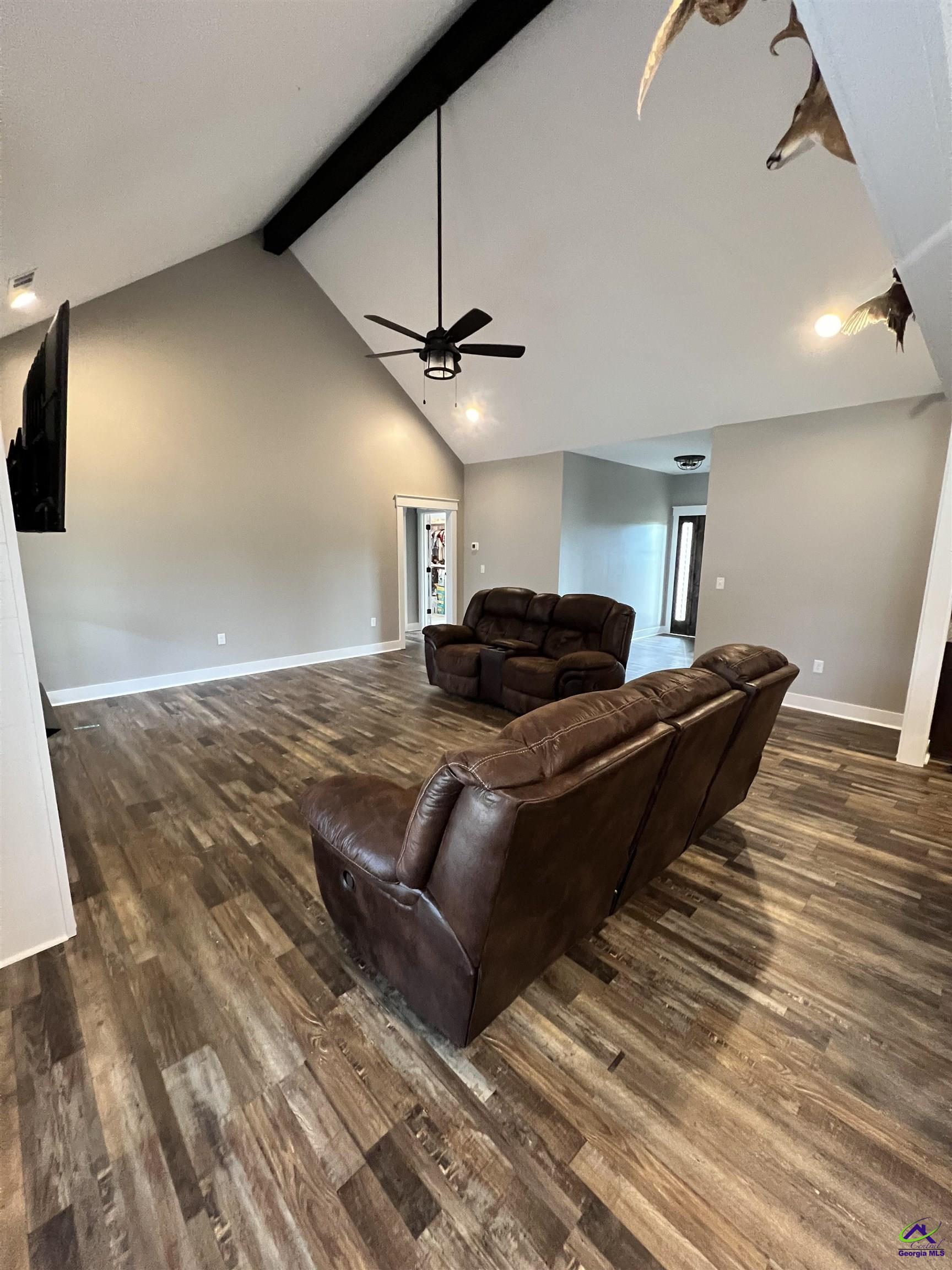 2203 Old Macon Road Montrose, GA 31065 - Photo 22 of 64 a living room with a bed furniture and a ceiling fan