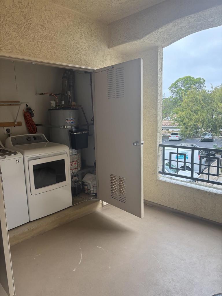 3575 Caminito El Rincon, Unit 216 San Diego, CA 92130 - Photo 13 of 14 a utility room with dryer and washer