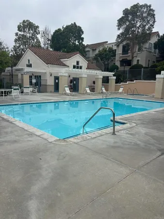 a room with gym equipment and a view of living room
