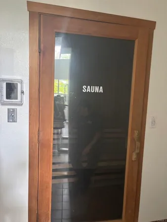 a view of a pathway both side of building with yard