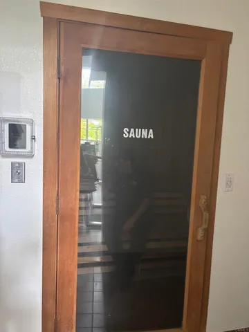 a view of a pathway both side of building with yard