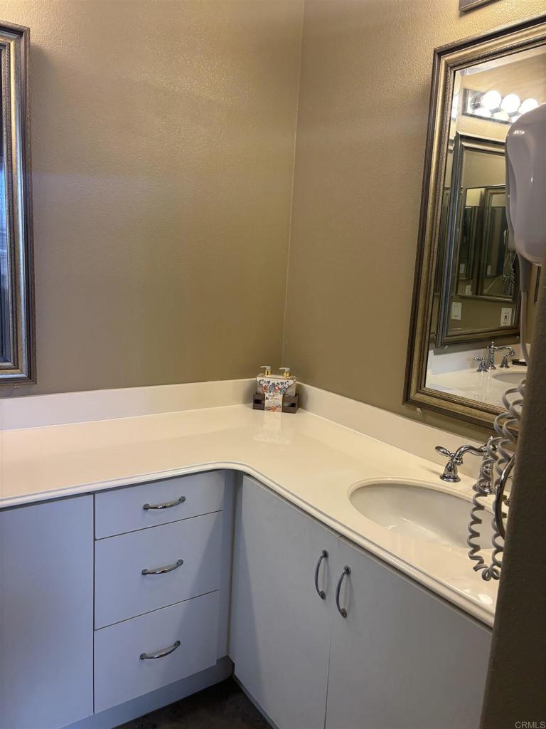 3575 Caminito El Rincon, Unit 216 San Diego, CA 92130 - Photo 10 of 14 a bathroom with a sink and a mirror
