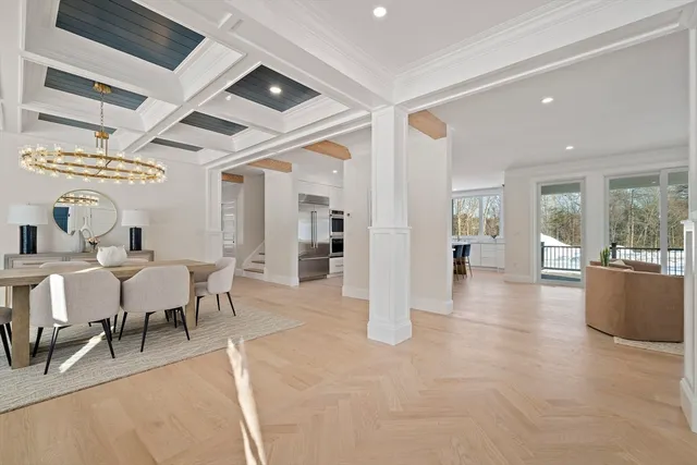 a view of a livingroom with furniture and kitchen view