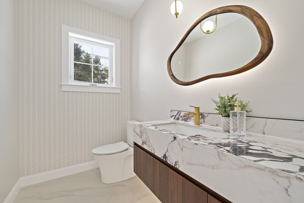 250 Center Street Hanover, MA 02339 - Photo 17 of 36 a bathroom with a sink and a mirror