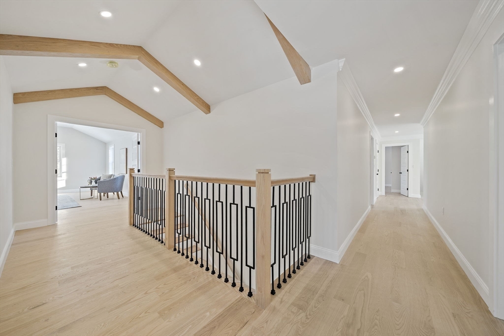 250 Center Street Hanover, MA 02339 - Photo 19 of 36 a view of a hallway with wooden floor and windows