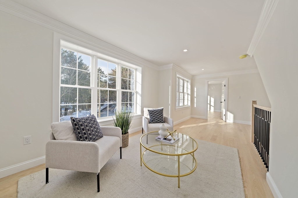 250 Center Street Hanover, MA 02339 - Photo 25 of 36 a living room with furniture and a large window