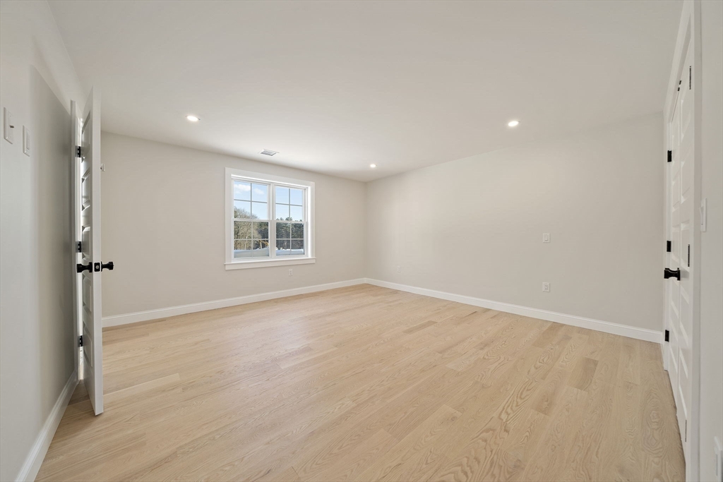 250 Center Street Hanover, MA 02339 - Photo 26 of 36 an empty room with windows and closet