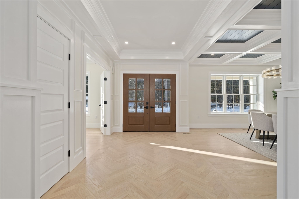 250 Center Street Hanover, MA 02339 - Photo 3 of 36 a view of a hallway with wooden floor and windows