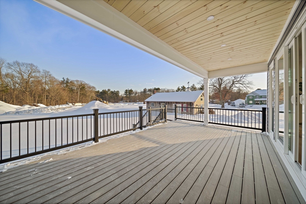 250 Center Street Hanover, MA 02339 - Photo 31 of 36 a balcony with wooden floor and fence