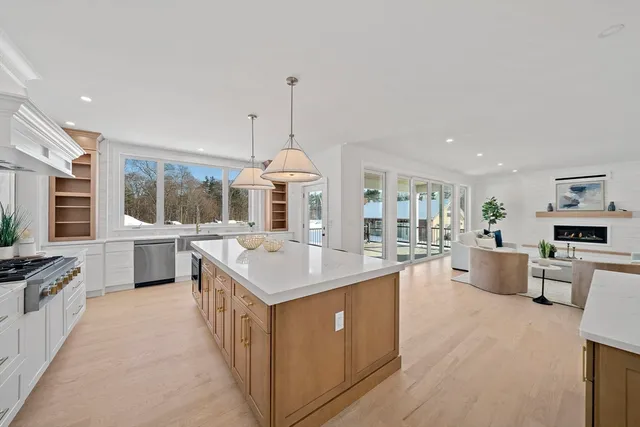 a kitchen with stainless steel appliances a sink stove and cabinets