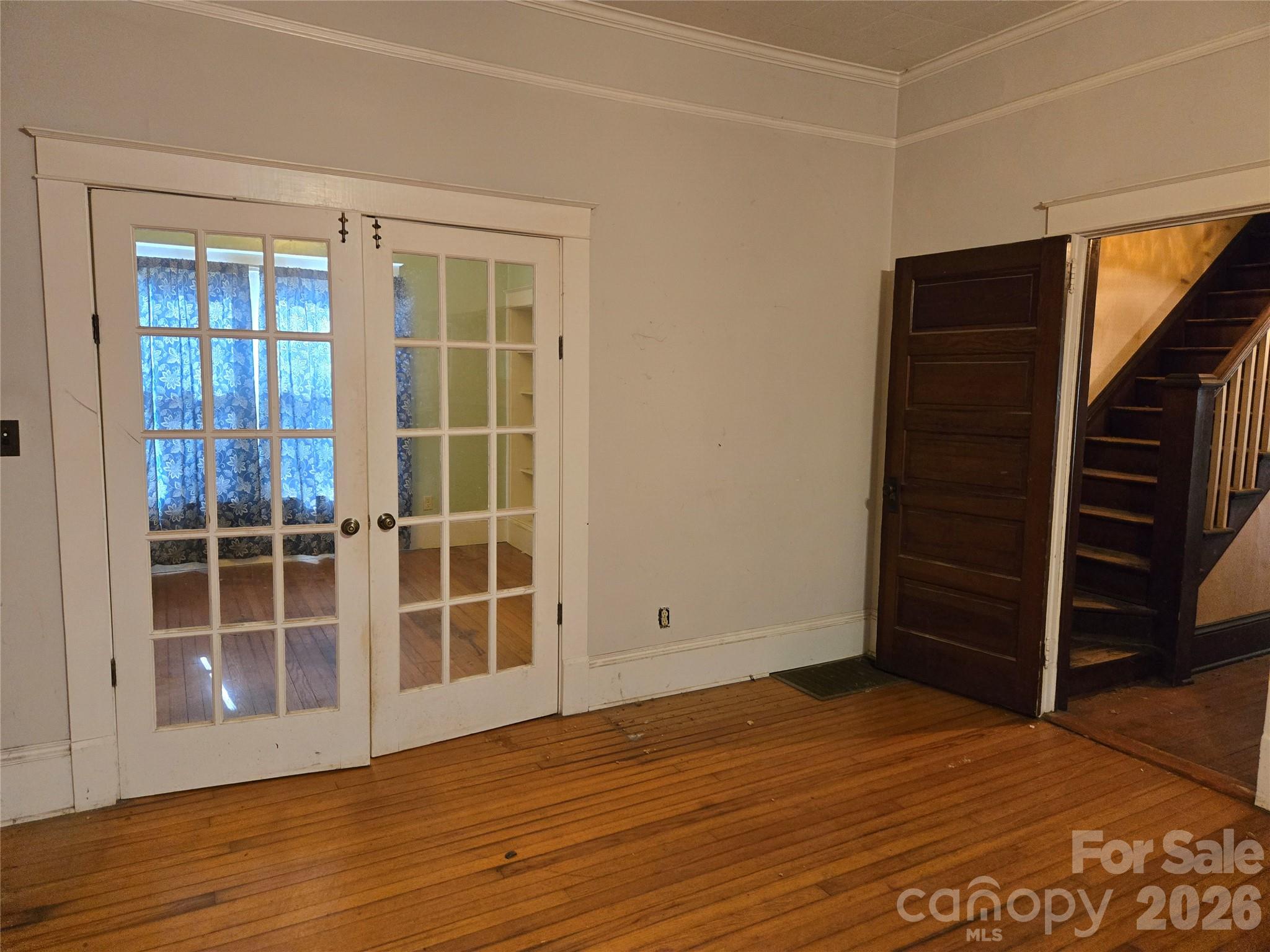 804 Emmanuel Church Road Conover, NC 28613 - Photo 11 of 36 an empty room with wooden floor closet and windows