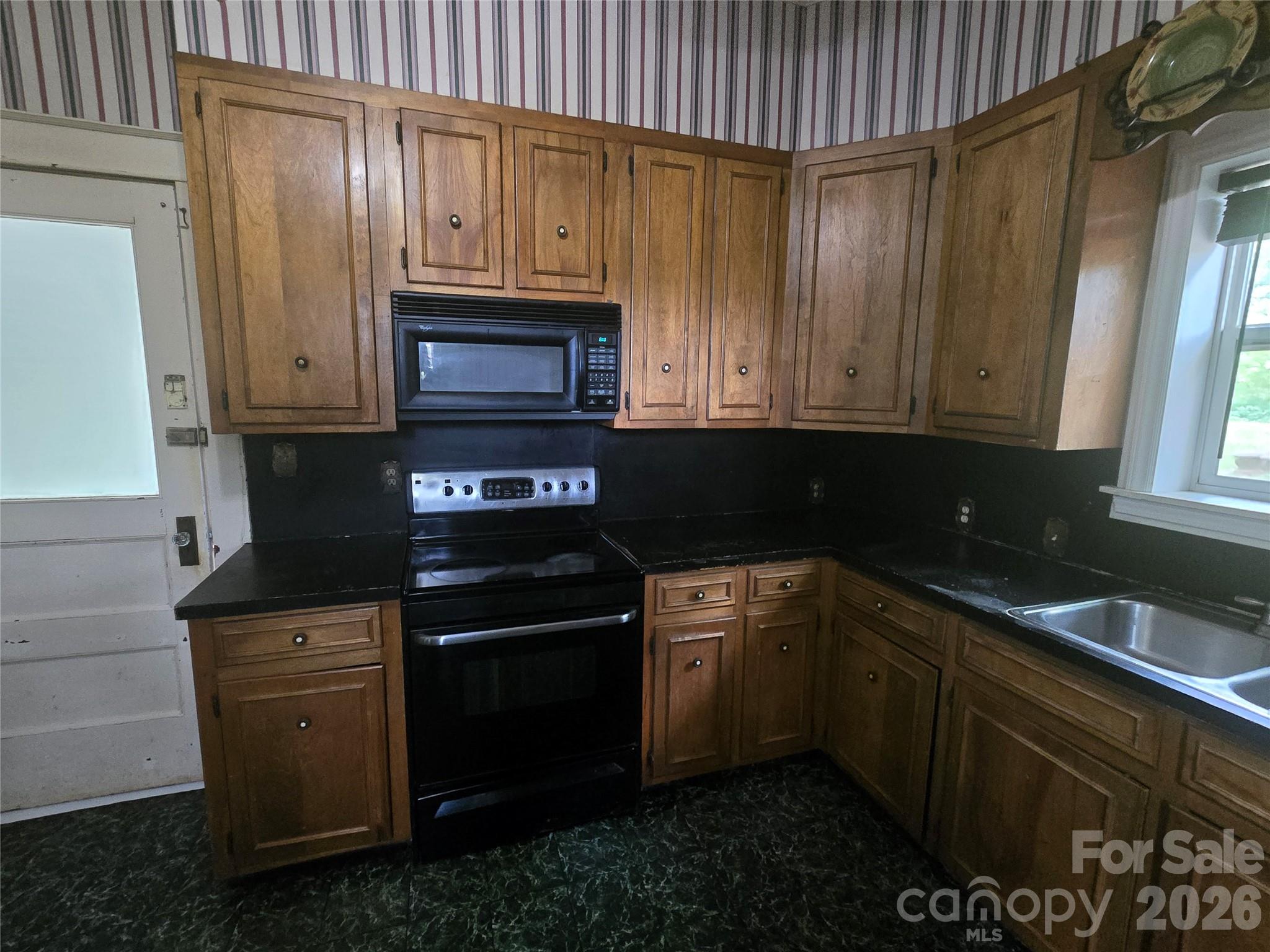 804 Emmanuel Church Road Conover, NC 28613 - Photo 18 of 36 a kitchen with granite countertop cabinets stainless steel appliances and a counter space