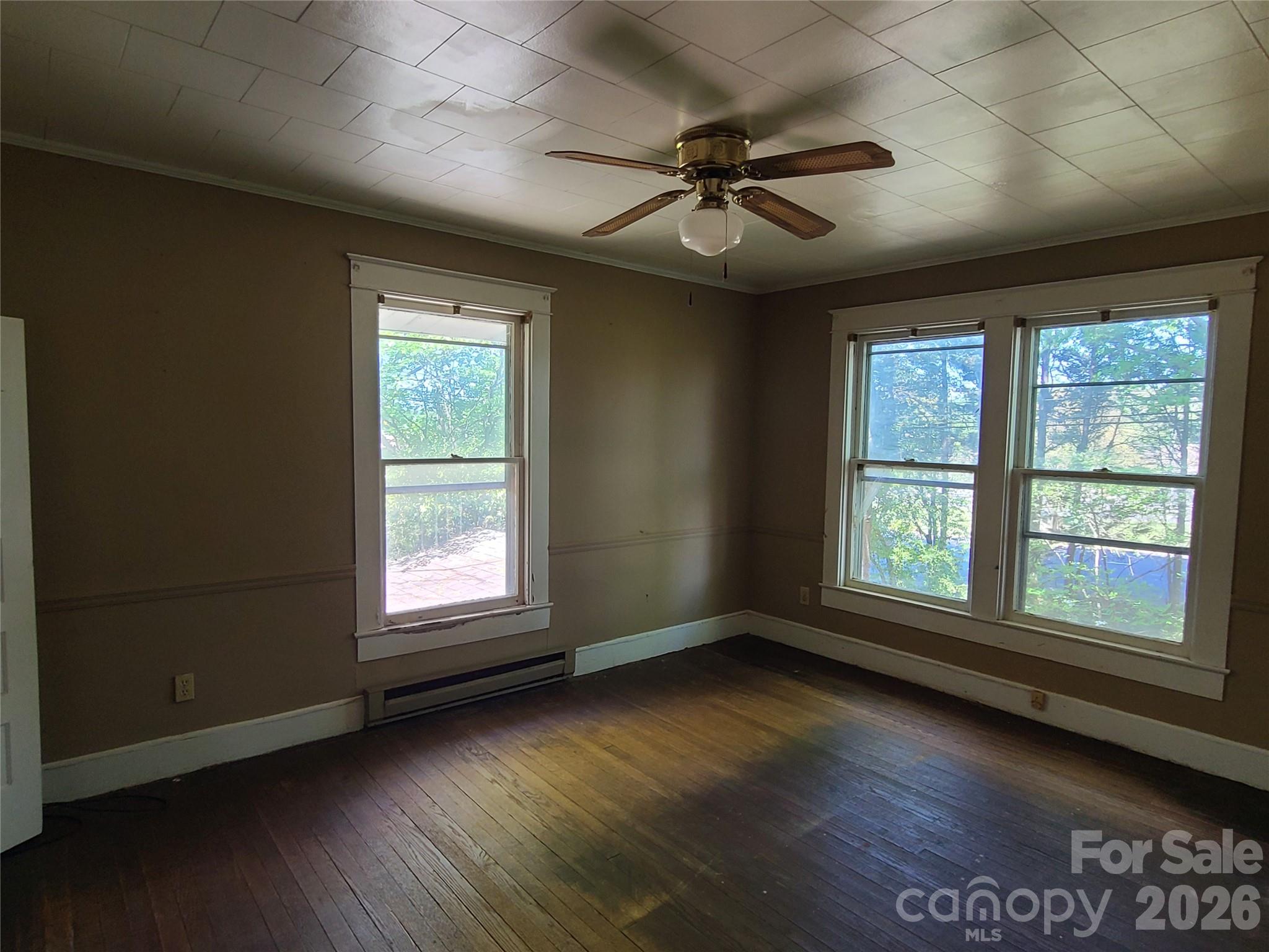 804 Emmanuel Church Road Conover, NC 28613 - Photo 28 of 36 a view of an empty room with wooden floor and a window