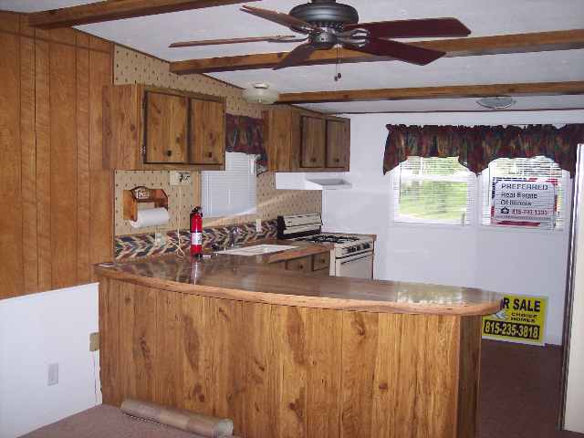 6807 West Stephenson St Road, Unit 58 Freeport, IL 61032 - Photo 2 of 3 a room with lots of different colored cloths