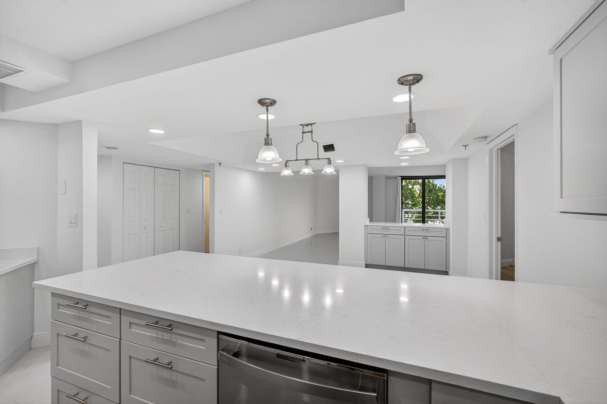 176 Helios Drive, Unit 209 Jupiter, FL 33477 - Photo 12 of 62 a view of a kitchen with a white wooden cabinets