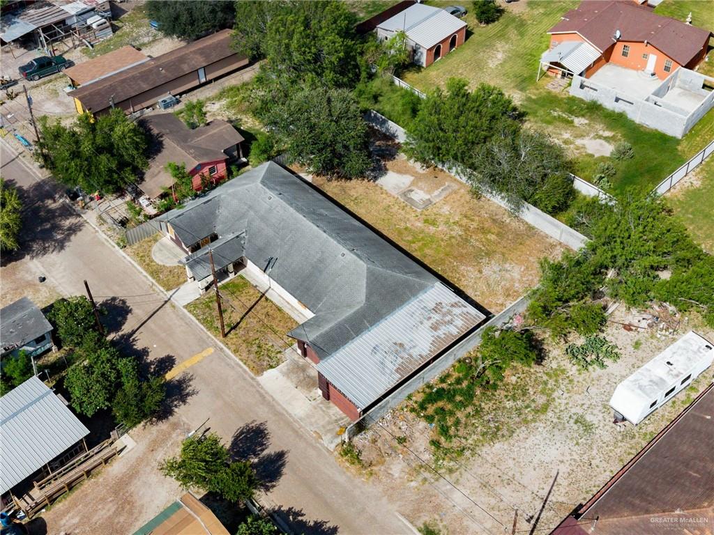 879 Austin Road Roma, TX 78584 - Photo 6 of 7 Aerial view showcasing a large lot with perimeter fencing and mature trees