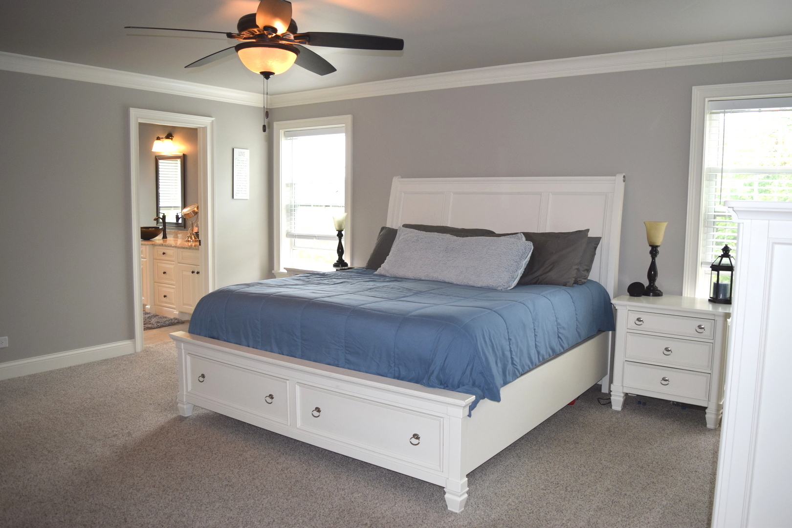 3003 Wayland Avenue Elgin, IL 60124 - Photo 12 of 32 a spacious bedroom with a bed and a chandelier