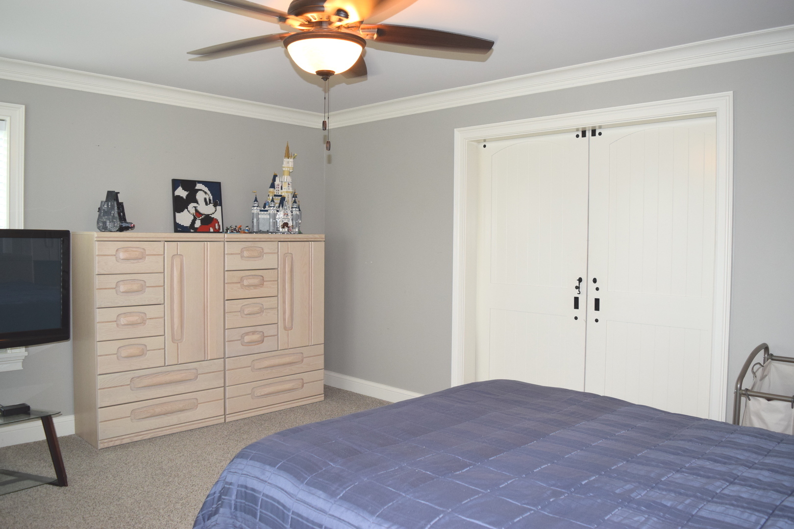 3003 Wayland Avenue Elgin, IL 60124 - Photo 19 of 32 a bedroom with a bed and a chandelier