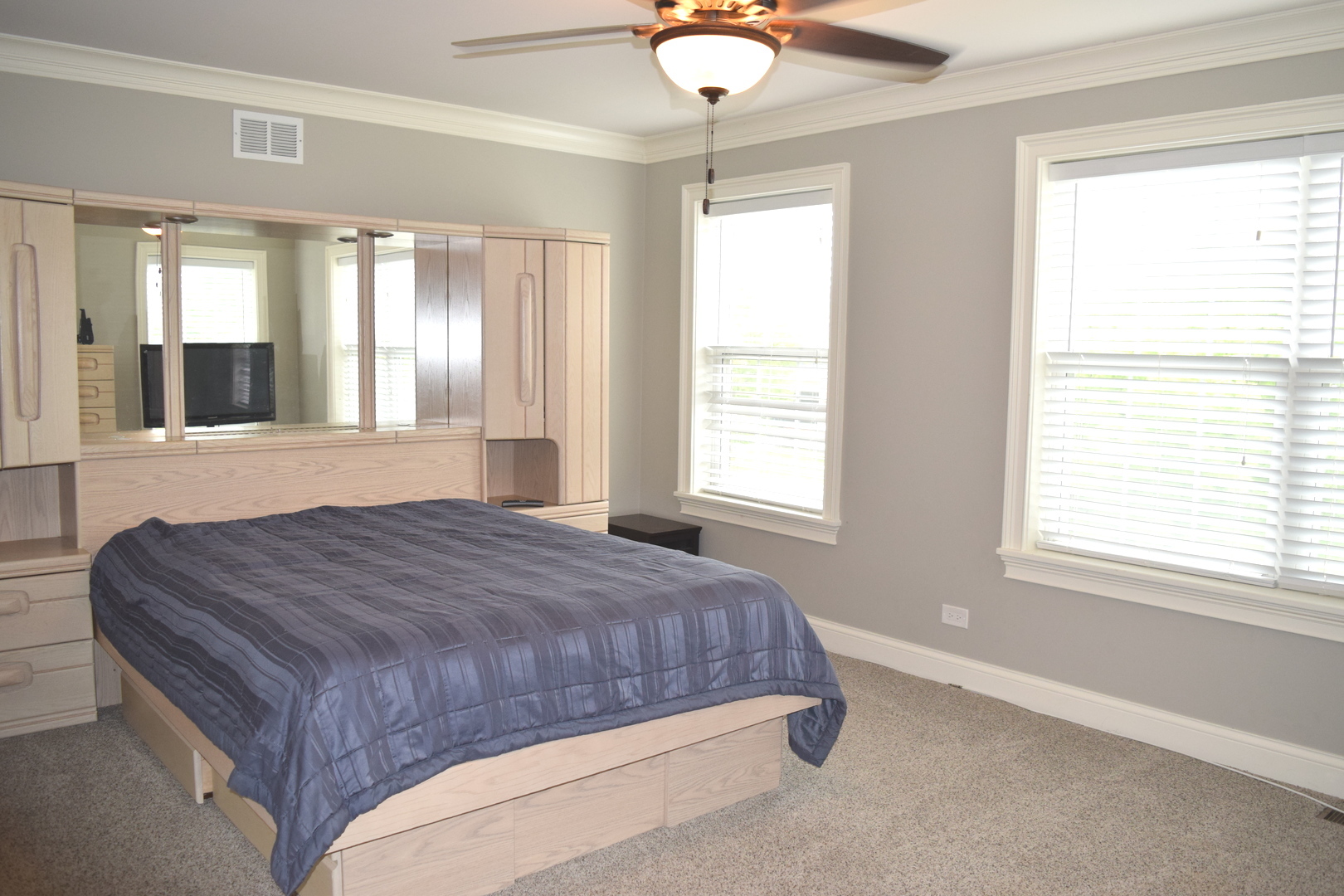 3003 Wayland Avenue Elgin, IL 60124 - Photo 20 of 32 a bedroom with a bed mirror and window