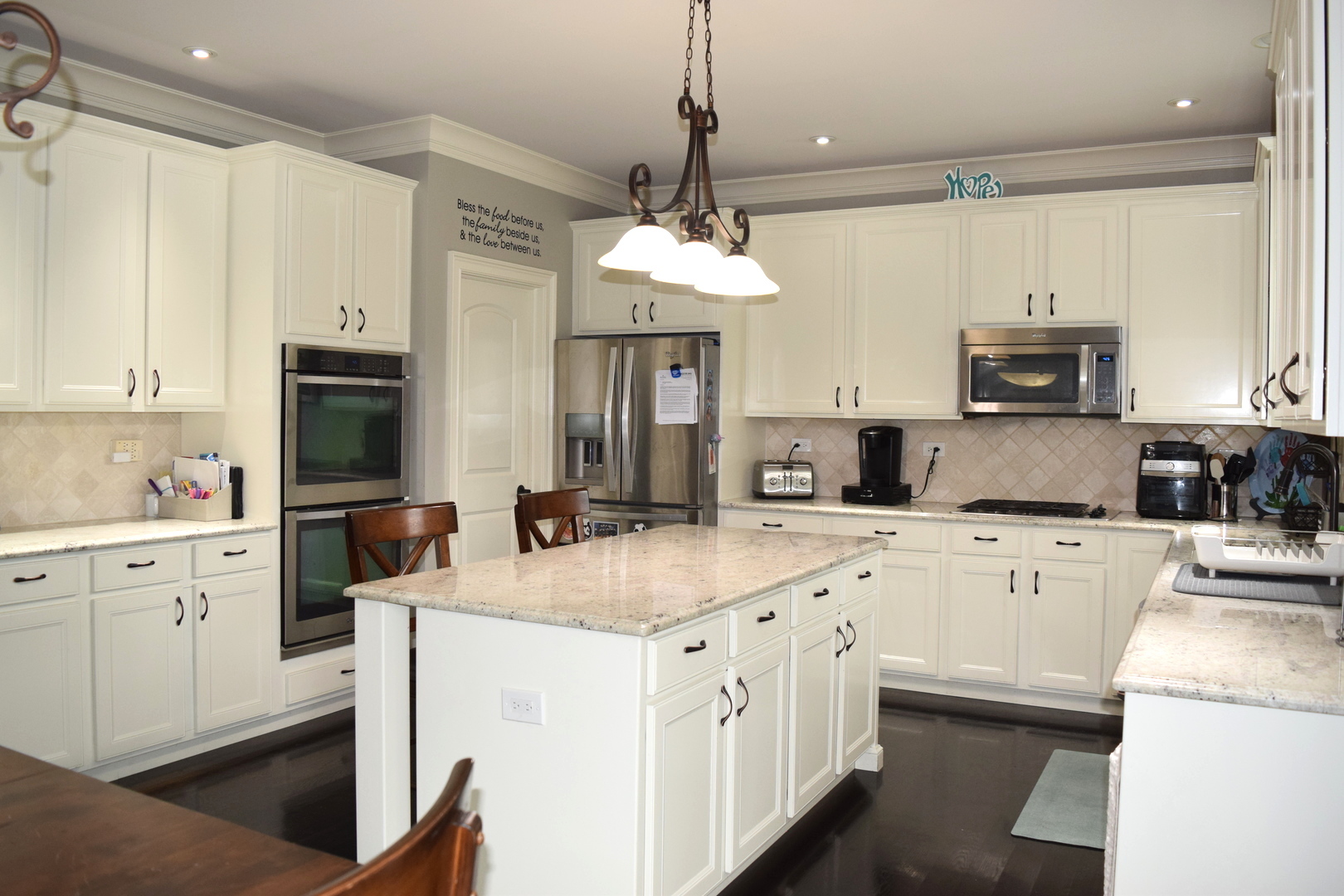 3003 Wayland Avenue Elgin, IL 60124 - Photo 5 of 32 a kitchen with cabinets appliances a sink and a counter top space