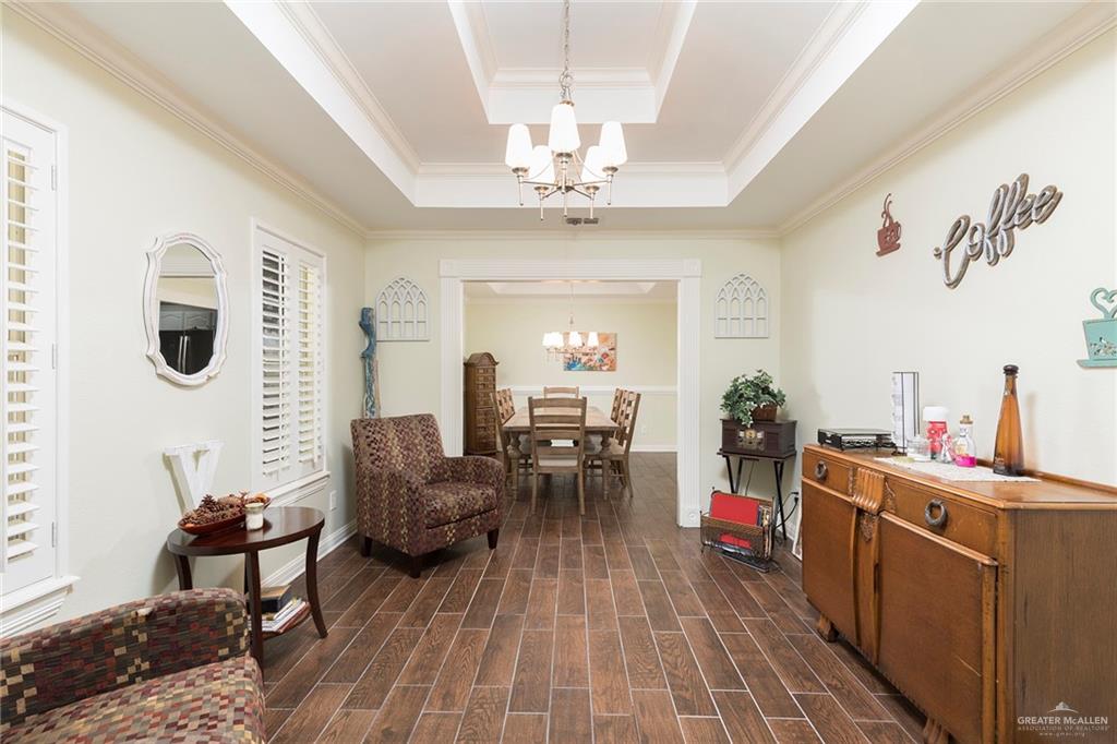 1902 Sundance Street Palmhurst, TX 78573 - Photo 12 of 43 a living room with furniture and a chandelier