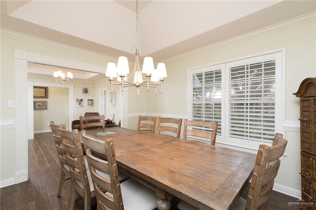 1902 Sundance Street Palmhurst, TX 78573 - Photo 13 of 43 a view of a dining room with furniture window and wooden floor