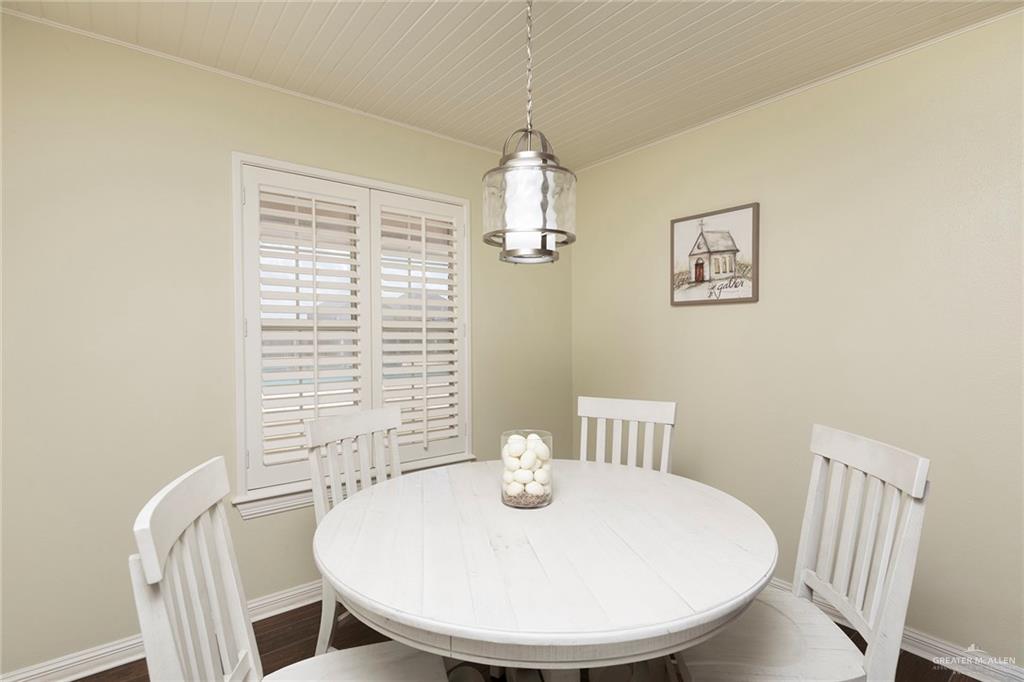 1902 Sundance Street Palmhurst, TX 78573 - Photo 14 of 43 a view of a dining room with furniture window and wooden floor