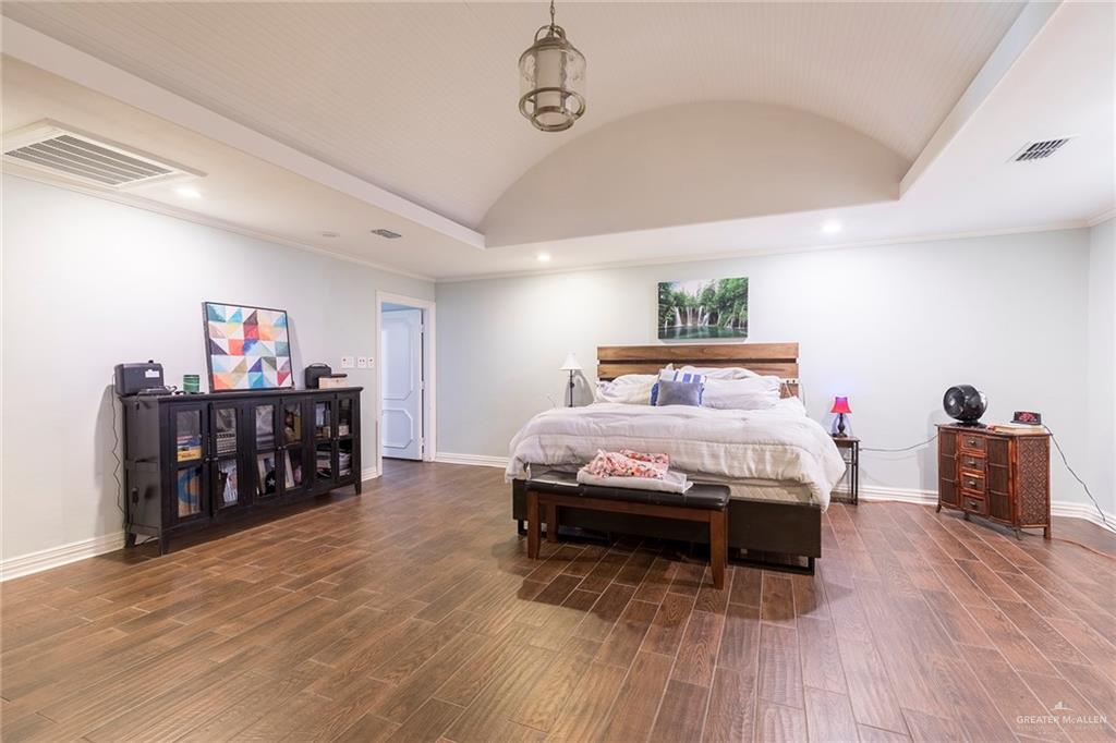 1902 Sundance Street Palmhurst, TX 78573 - Photo 15 of 43 a bedroom with bed and wooden floor