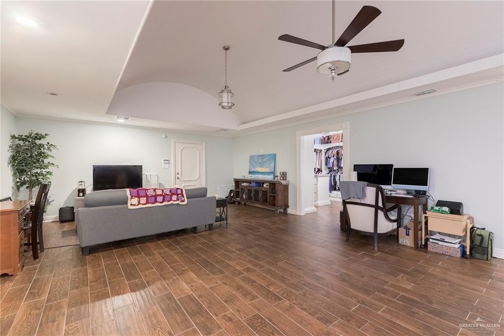 1902 Sundance Street Palmhurst, TX 78573 - Photo 16 of 43 a living room with furniture and a wooden floor
