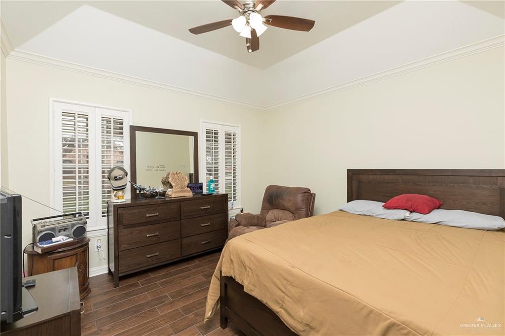 1902 Sundance Street Palmhurst, TX 78573 - Photo 24 of 43 a bedroom with a bed and wooden floor