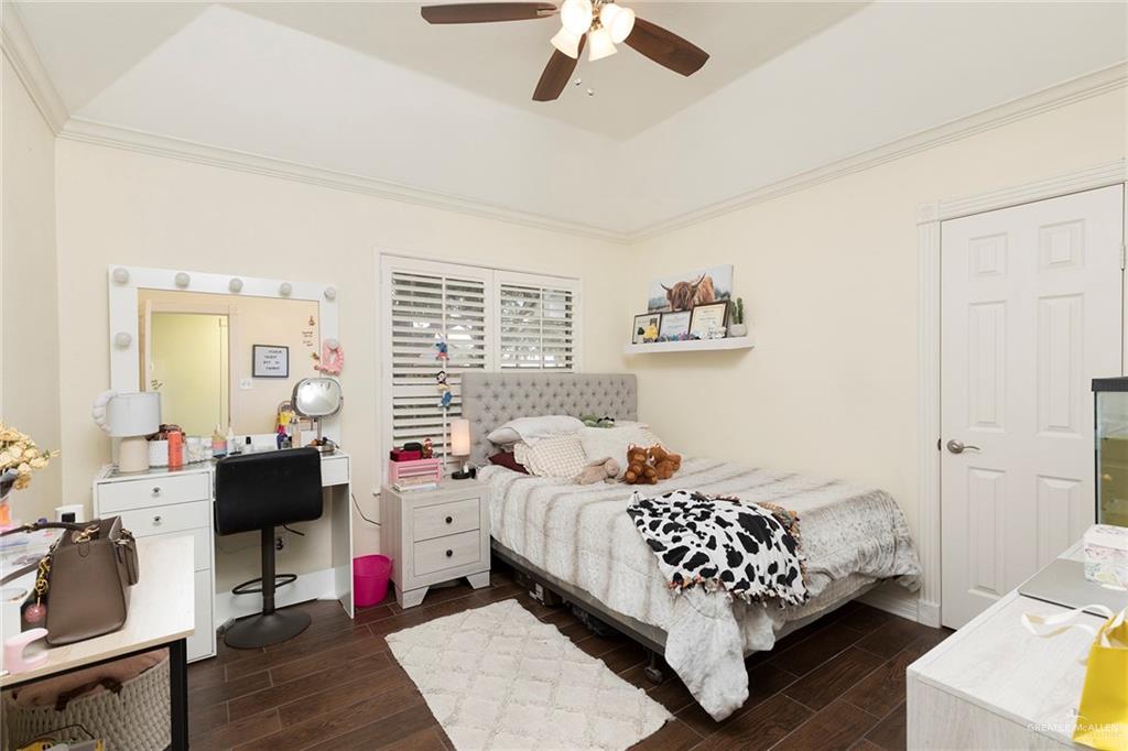 1902 Sundance Street Palmhurst, TX 78573 - Photo 26 of 43 a bedroom with a bed and wooden floor