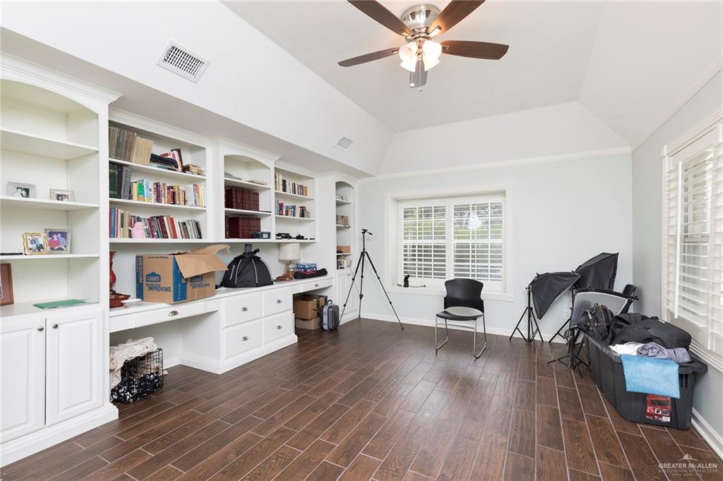 1902 Sundance Street Palmhurst, TX 78573 - Photo 27 of 43 a view of a workspace with furniture and a window
